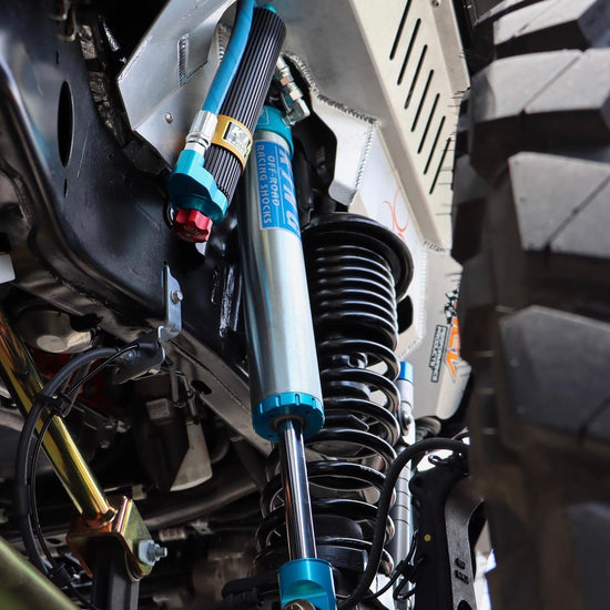 Suspension on a 2020 Jeep Wrangler including springs and struts.