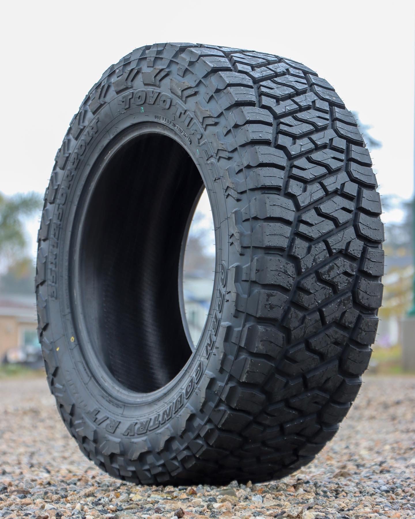 The Toyo Open Country R/T Trail Sitting in a gravel field.