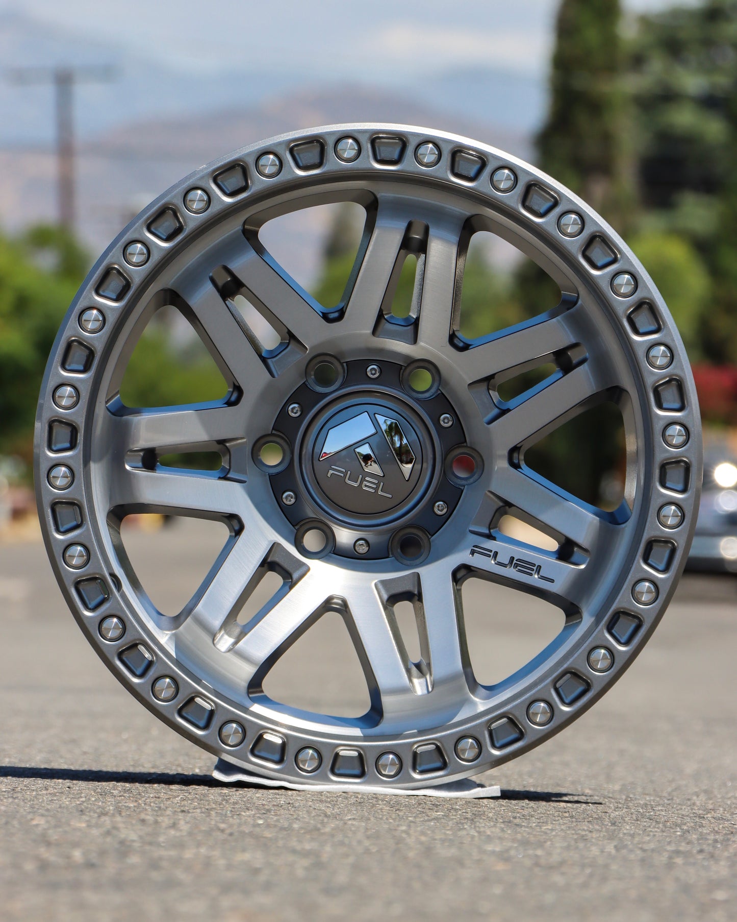 Fuel Syndicate Wheel in the middle of the street on the ground.