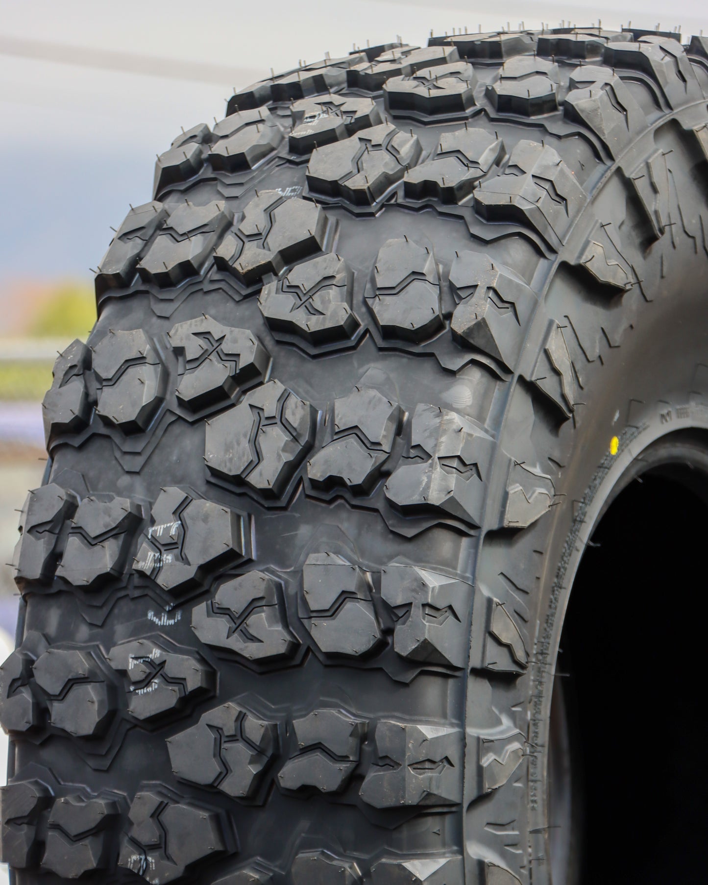 Close-up of the Yokohama Geolandar X-M/T tire showing the tread.