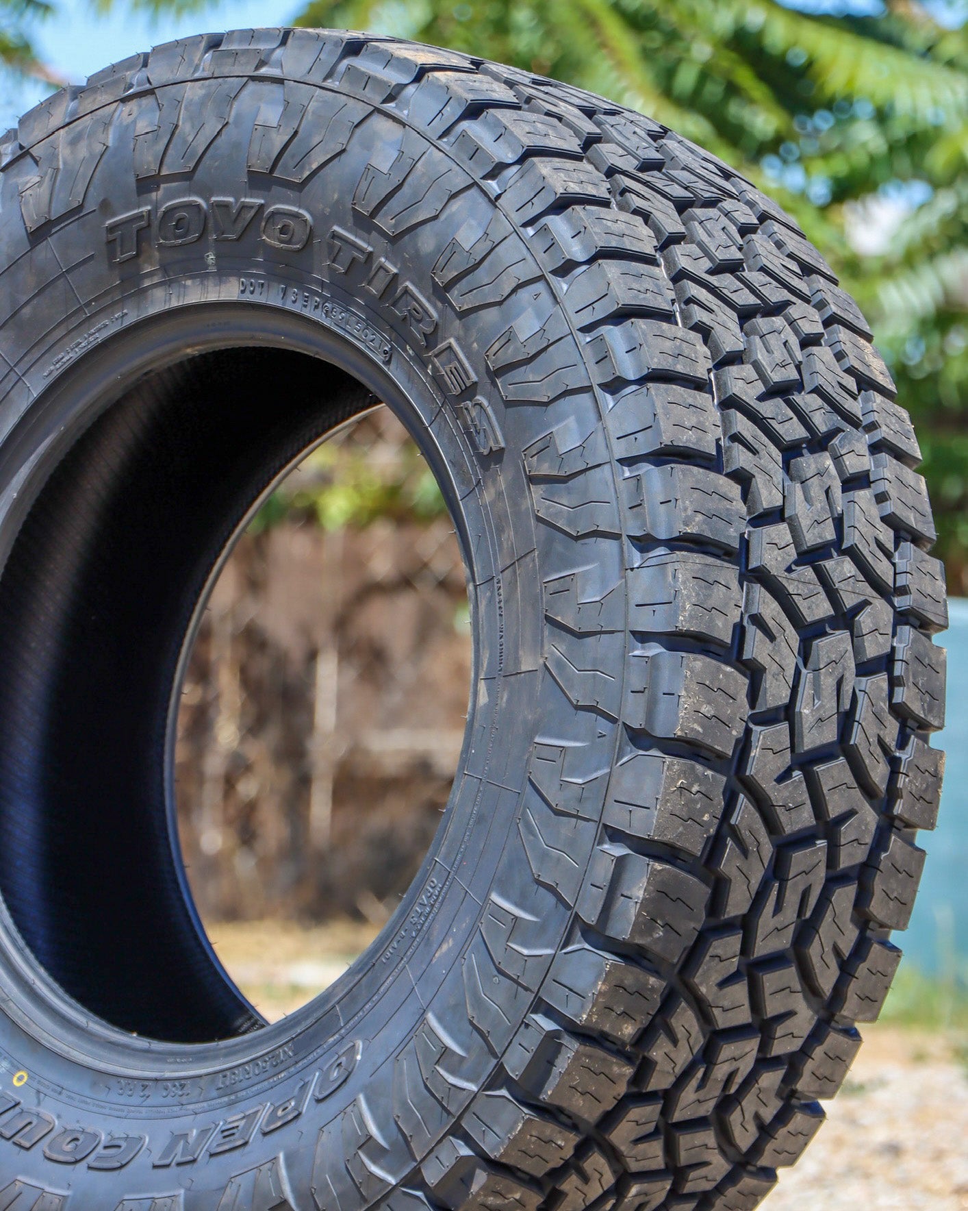 Close-up of the Toyo Open Country ATIII showing the tread and Sidewall.