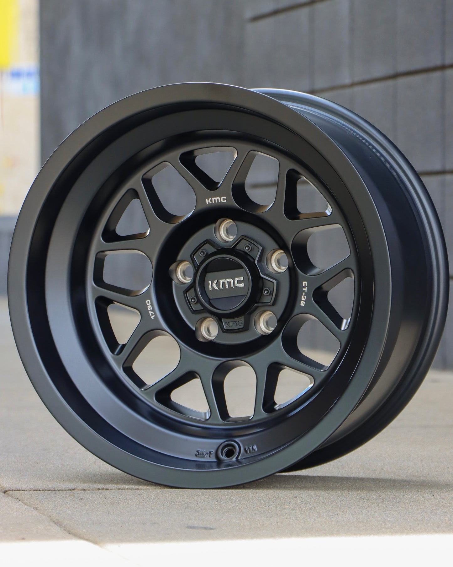 KMC Terra Wheel sitting on some concrete