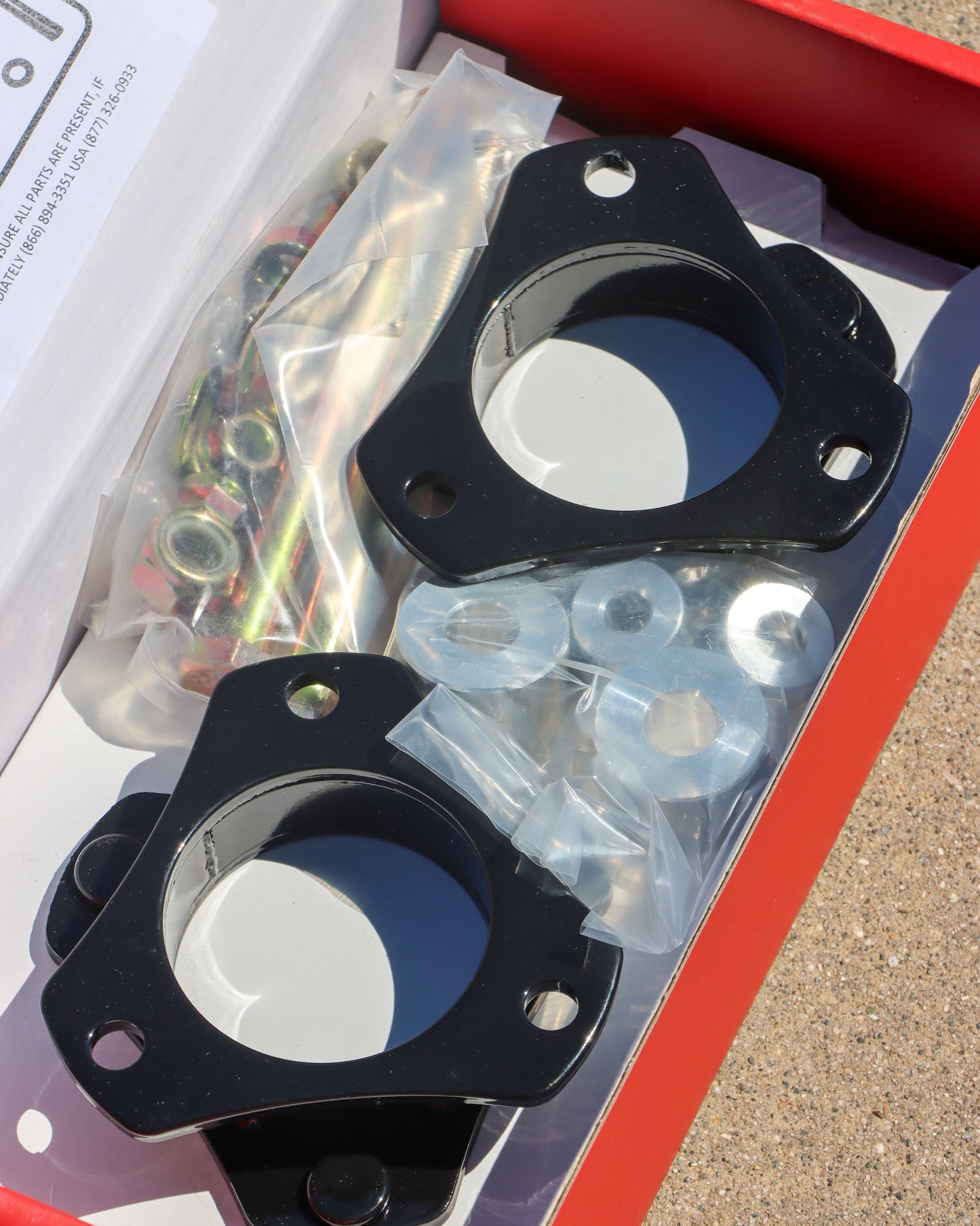 Open lift kit box showing all of the contents of the lift inside.
