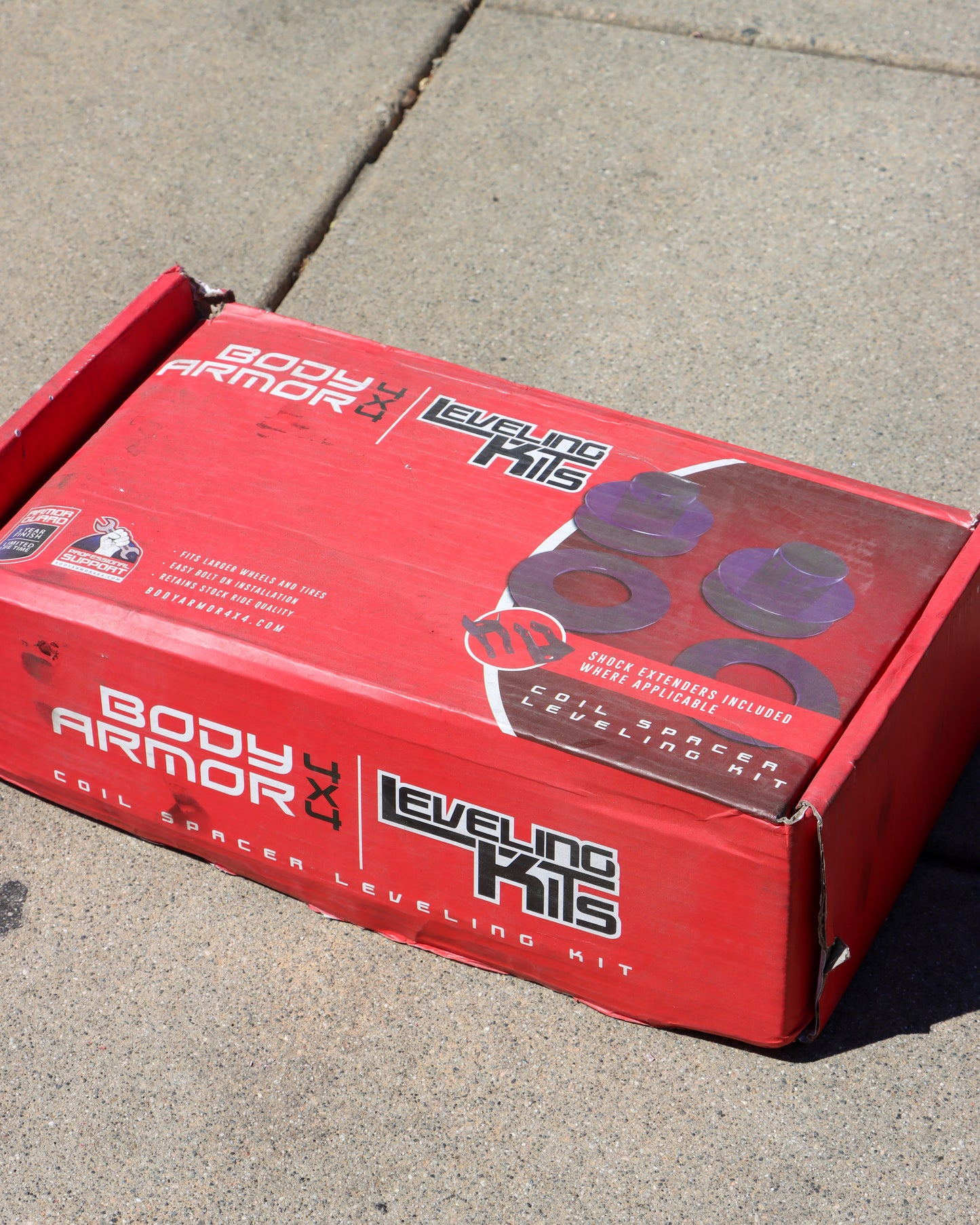 Body Armor Leveling Kit Box on The Floor.
