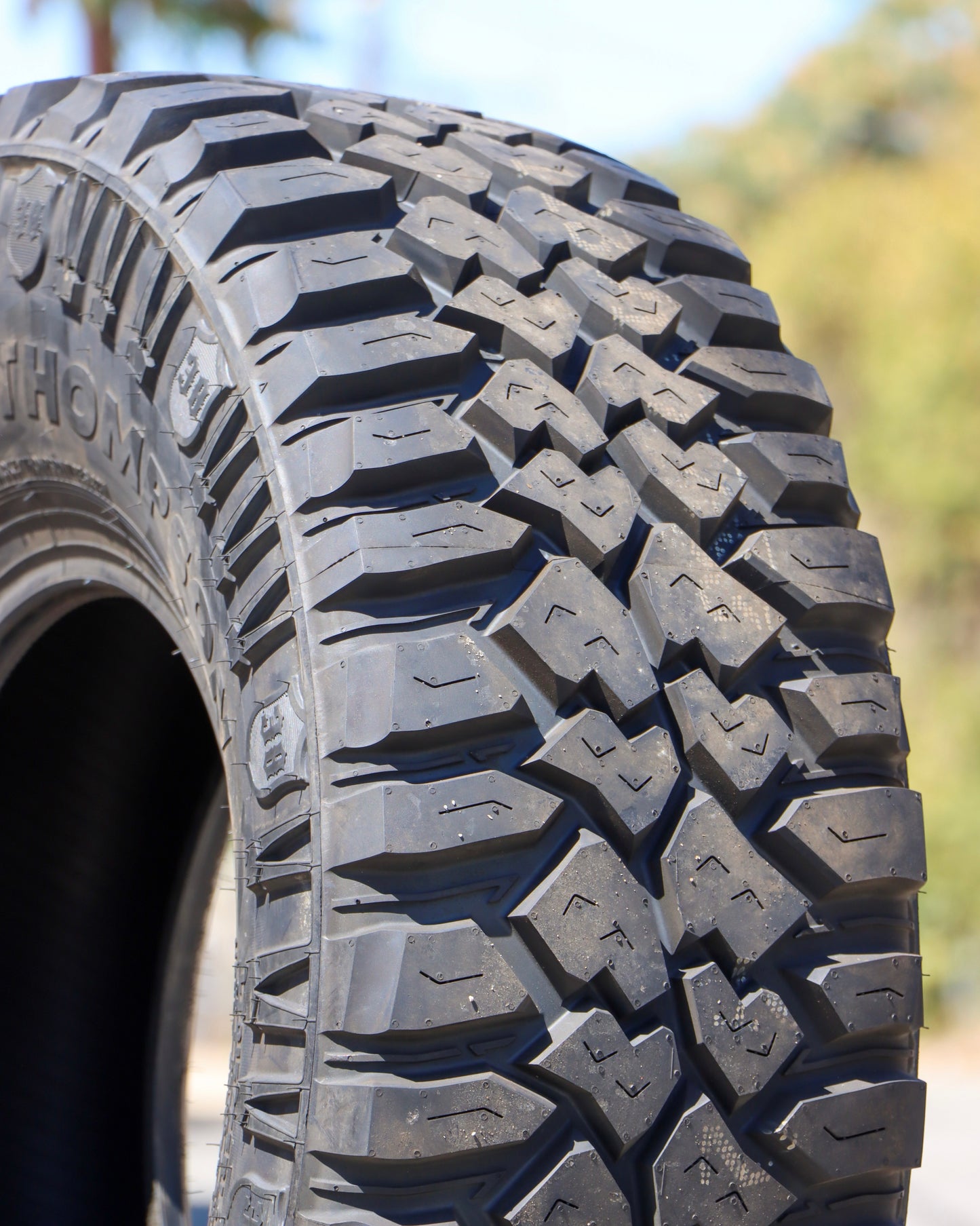 close-up of the mickey thompson deagan 38 tire showing mostly the tread and a little sidewall.