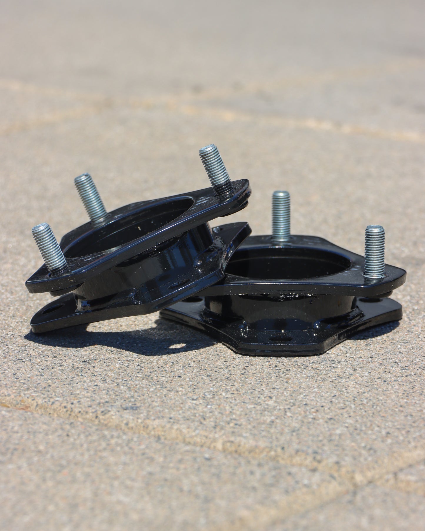 Strut spacers lying on the ground.
