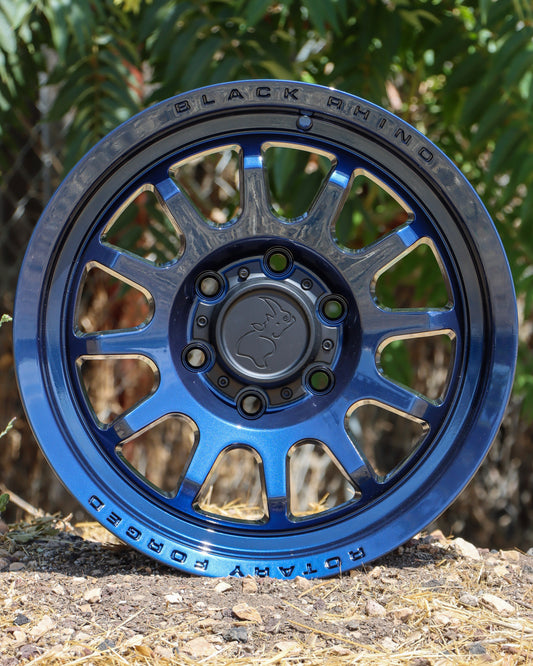 Black Rhino Rapid Wheel with a Midnight Blue finish, sitting on the ground.