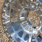 Close-up of the kmc impact forged bead lock wheel on gravel.