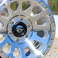 Close-up of the Fuel Syndicate Wheel lying on gravel.