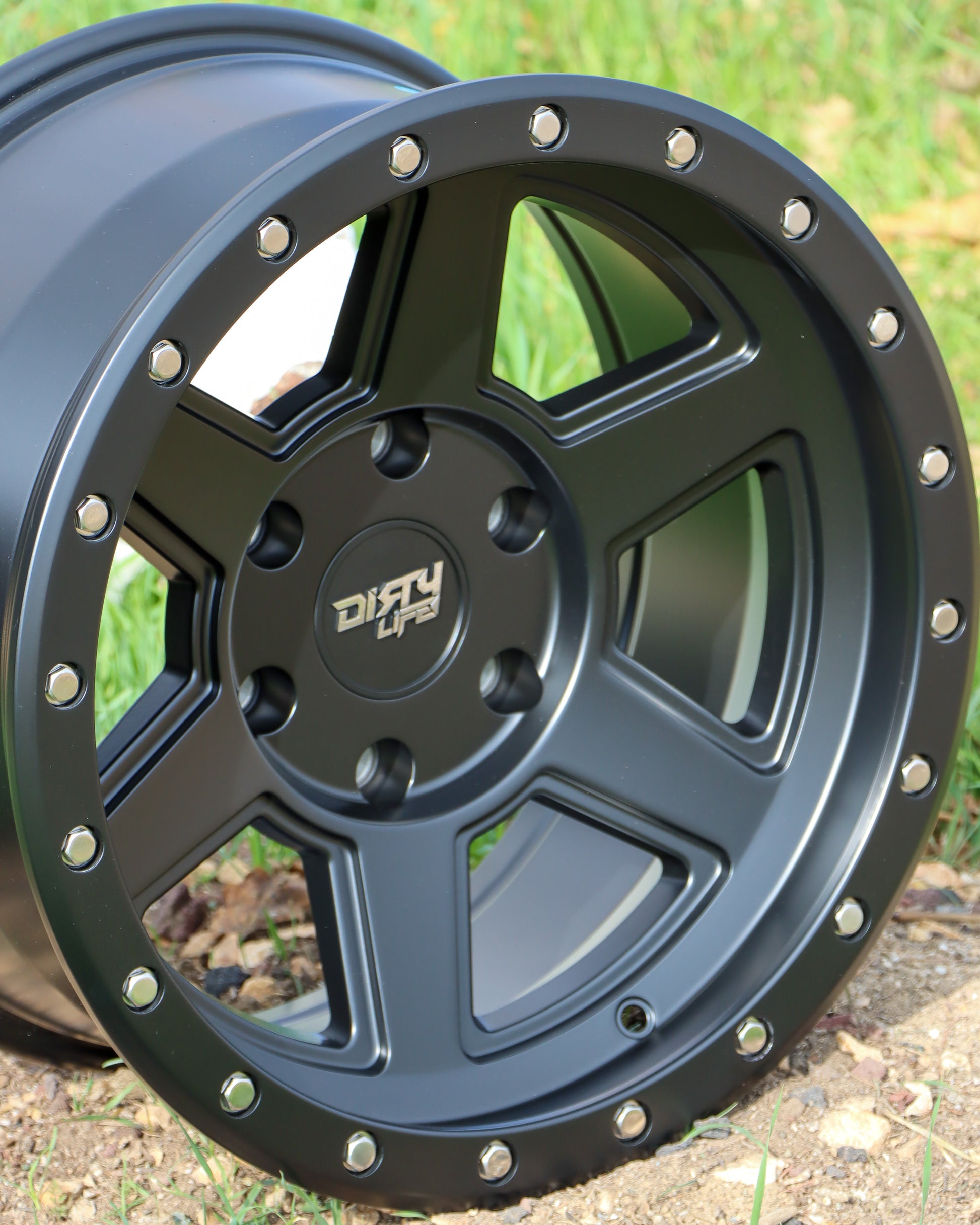 Closeup of the Dirty Life Compound Wheel in  a matte black finish.