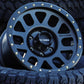 Method MR309 Grid wheel in a matte Black finish sitting in a tire.