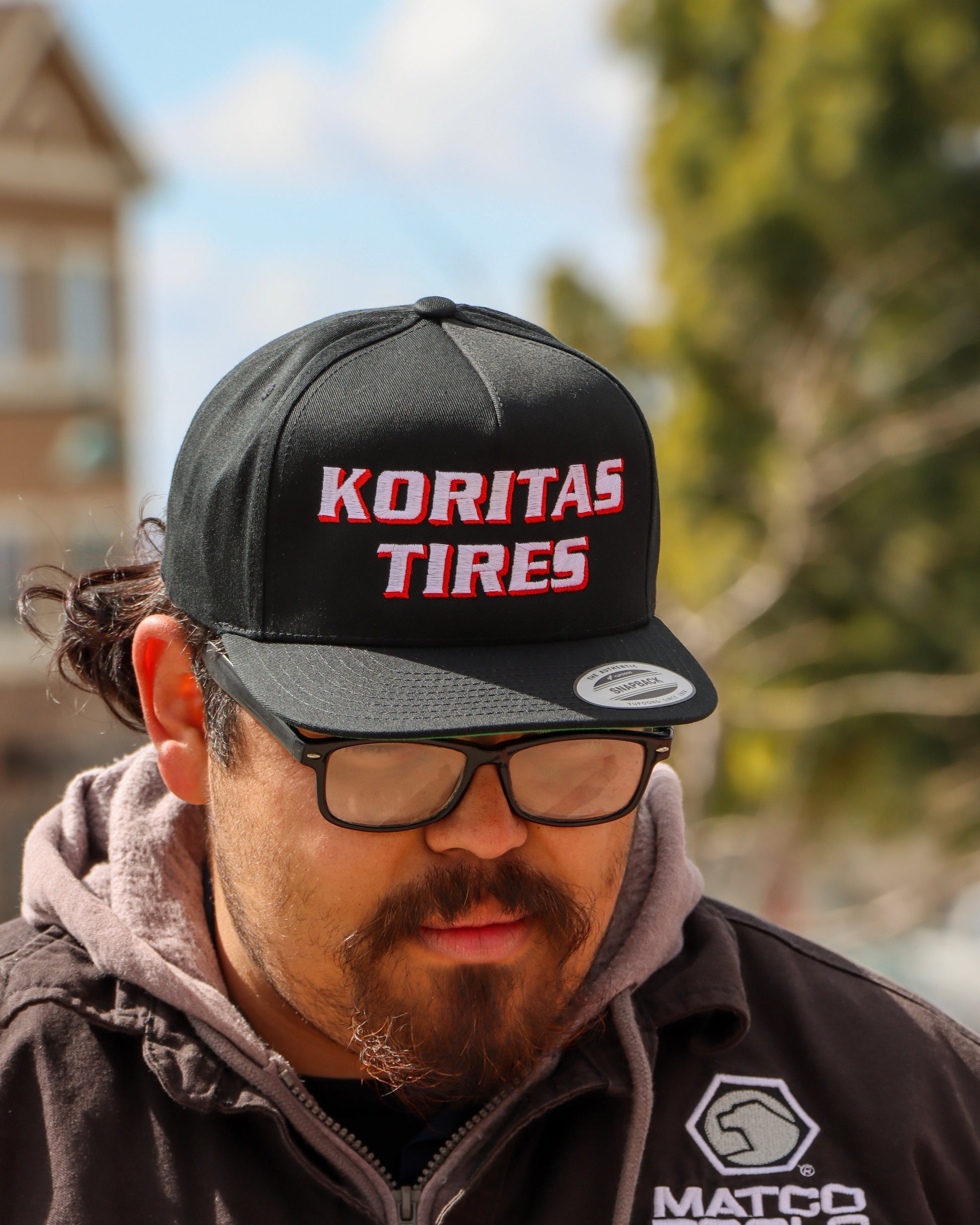 Model wearing the Koritas Tires Classic Snapback.