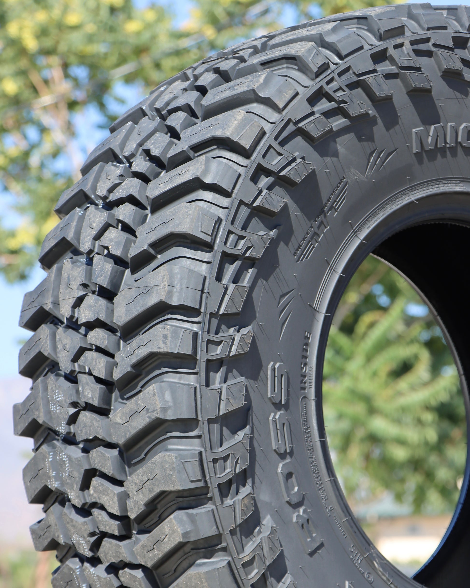 close-up view of the mickey thompson baja boss tire showing the tread and the sidewall.