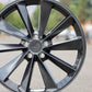 TSW Aileron Wheel in a gunmetal gray finish sitting in the middle of the street.