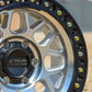 Closeup of thge kmc grs wheel in a machined finish with a black lip