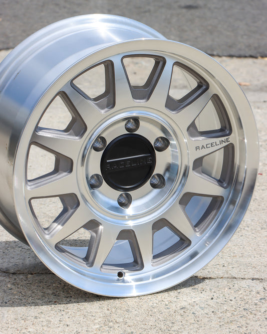 Raceline Areo wheel in a machined finish sitting on the concrete.