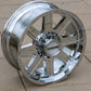 topside view the raceline hostage wheel in a chrome finish on the sidewalk.